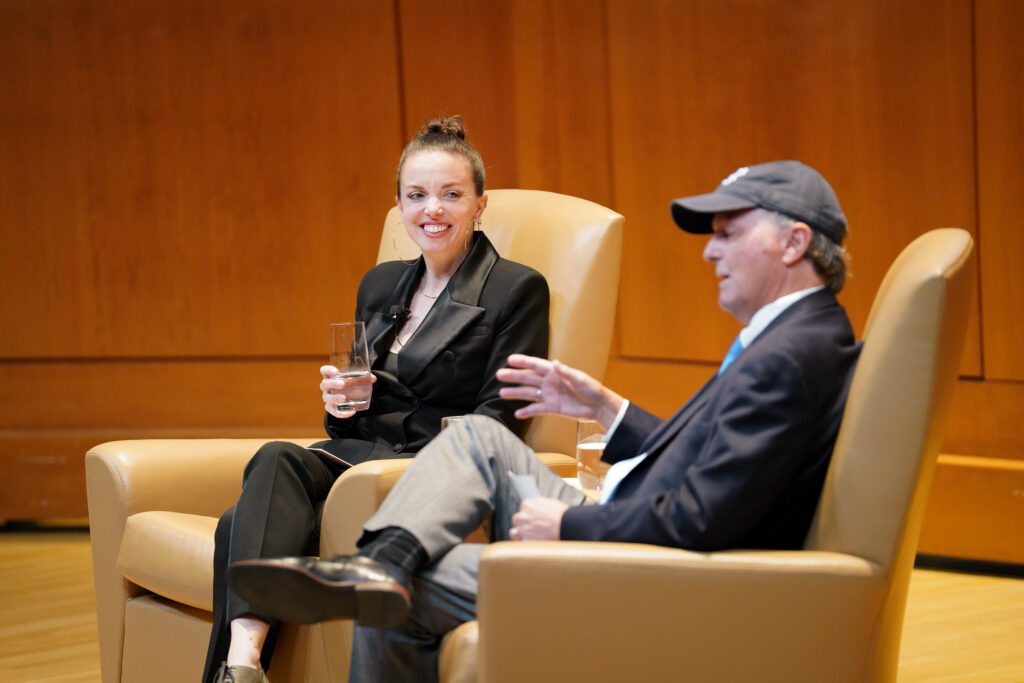 Keynote lecturer Michelle Dorrance talks with her father, Anson Dorrance, at the Eve Marie Carson Lecture Series in Moeser Auditorium in Hill Hall on Sept. 28th, 2022.