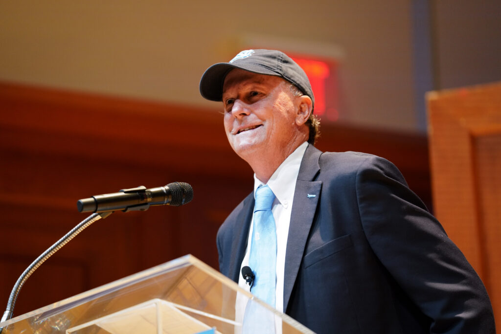 UNC Women's Soccer coach Anson Dorrance introduces the speaker, Michelle Dorrance, at the Eve Marie Carson Lecture Series in Moeser Auditorium in Hill Hall on Sept. 28th, 2022.