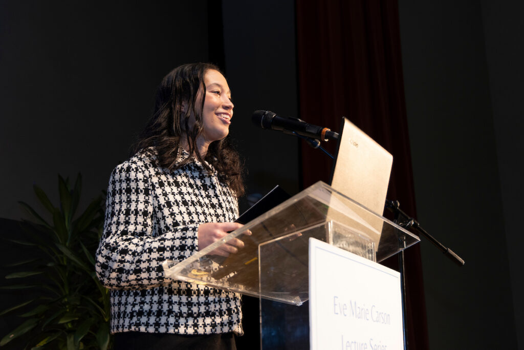 Student body president, Jaleah Taylor, on stage presenting
