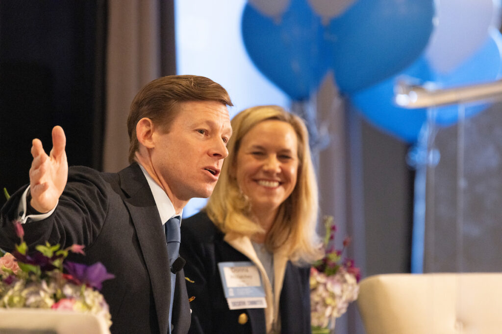 Chancellor Lee Roberts and Donna McClatchey on stage presenting at the annual meeting